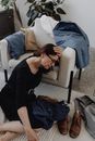 Woman in Black Long Sleeve Shirt Sitting on White Couch