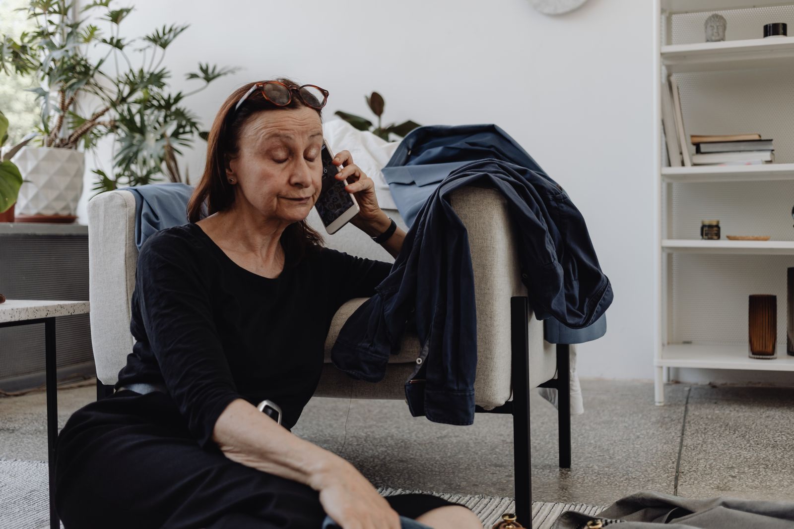Older woman enjoying a relaxed phone conversation at home