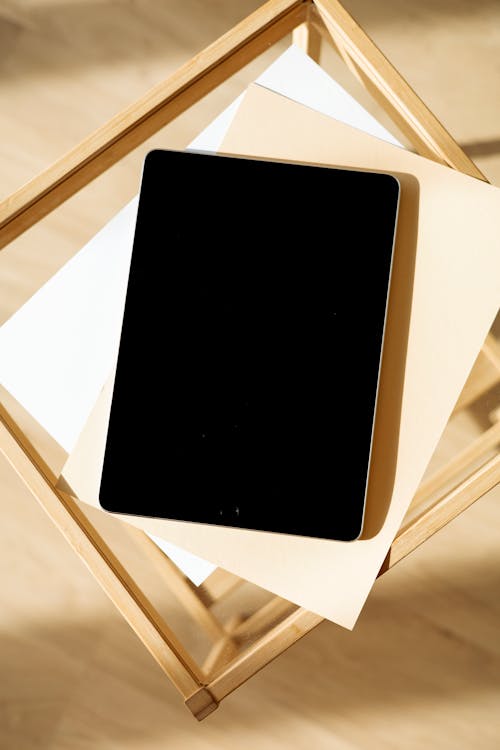 Free An Ipad on Top of a Blank Sheet Stock Photo