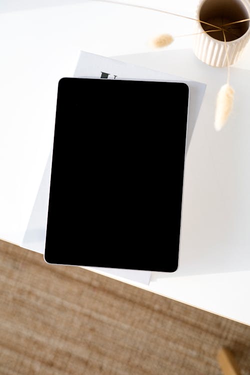 Free Black Ipad on White Table Stock Photo