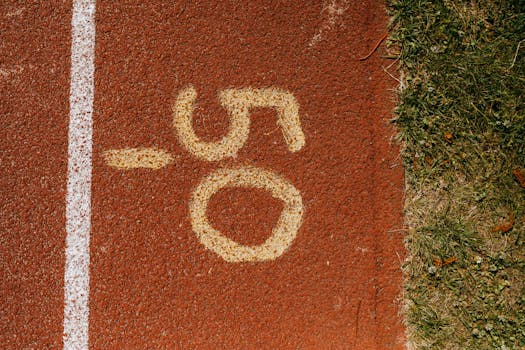 Close-up view of the number 50 on a track, symbolizing athletic distance marking.