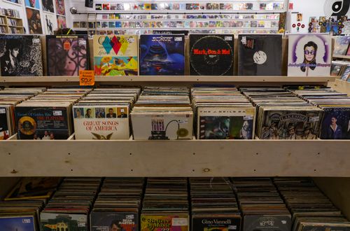Free Browse a diverse collection of vintage vinyl records displayed in a Tulsa record shop. Stock Photo