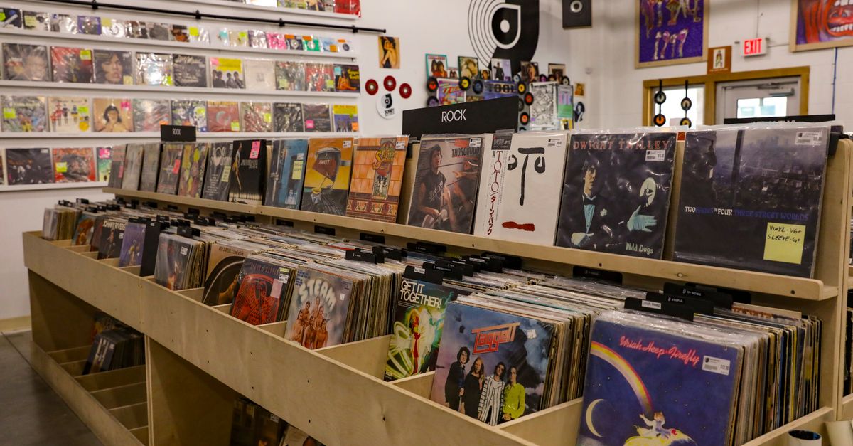 Independent record store shelves packed with colorful vinyl albums