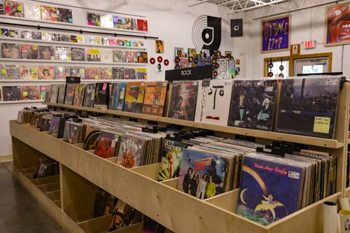 Free Browse vinyl records at a retro store in Tulsa, OK, featuring classic rock and eclectic album covers. Stock Photo
