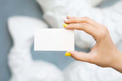 Person Holding a Blank Paper