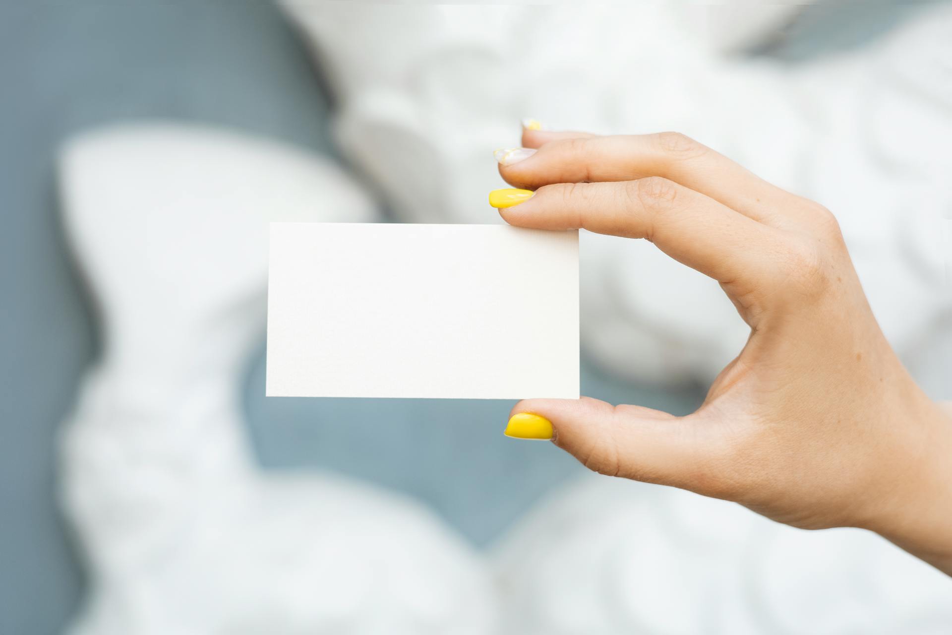 Person Holding a Blank Paper