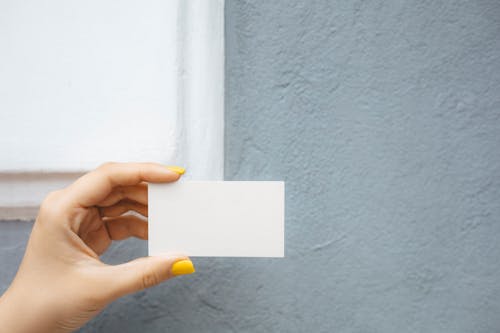 Person Holding a Blank Card