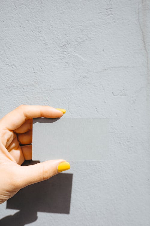 Person Holding a Gray Blank Card