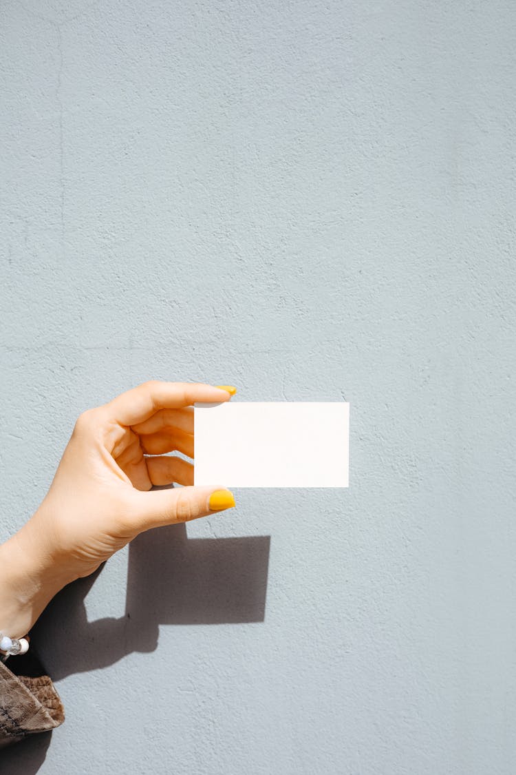 Person Holding A Blank Card