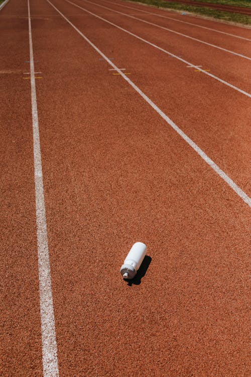 White Tumbler on Brown and White Race Track