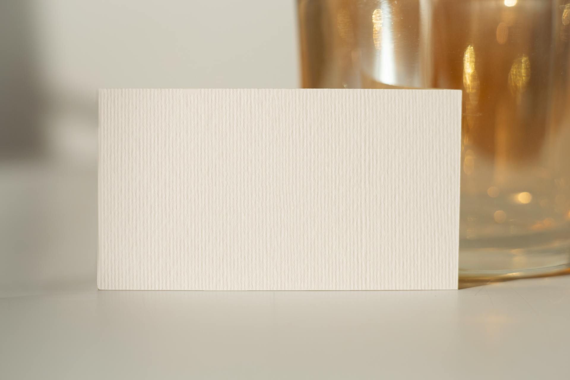 Minimalist photo of a textured blank card suitable for mockups and design presentations.