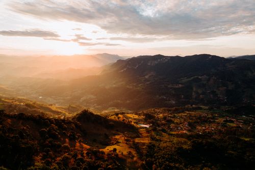 Free A stunning aerial view of São Bento do Sapucaí during golden hour, capturing the scenic beauty of Brazilian mountains. Stock Photo
