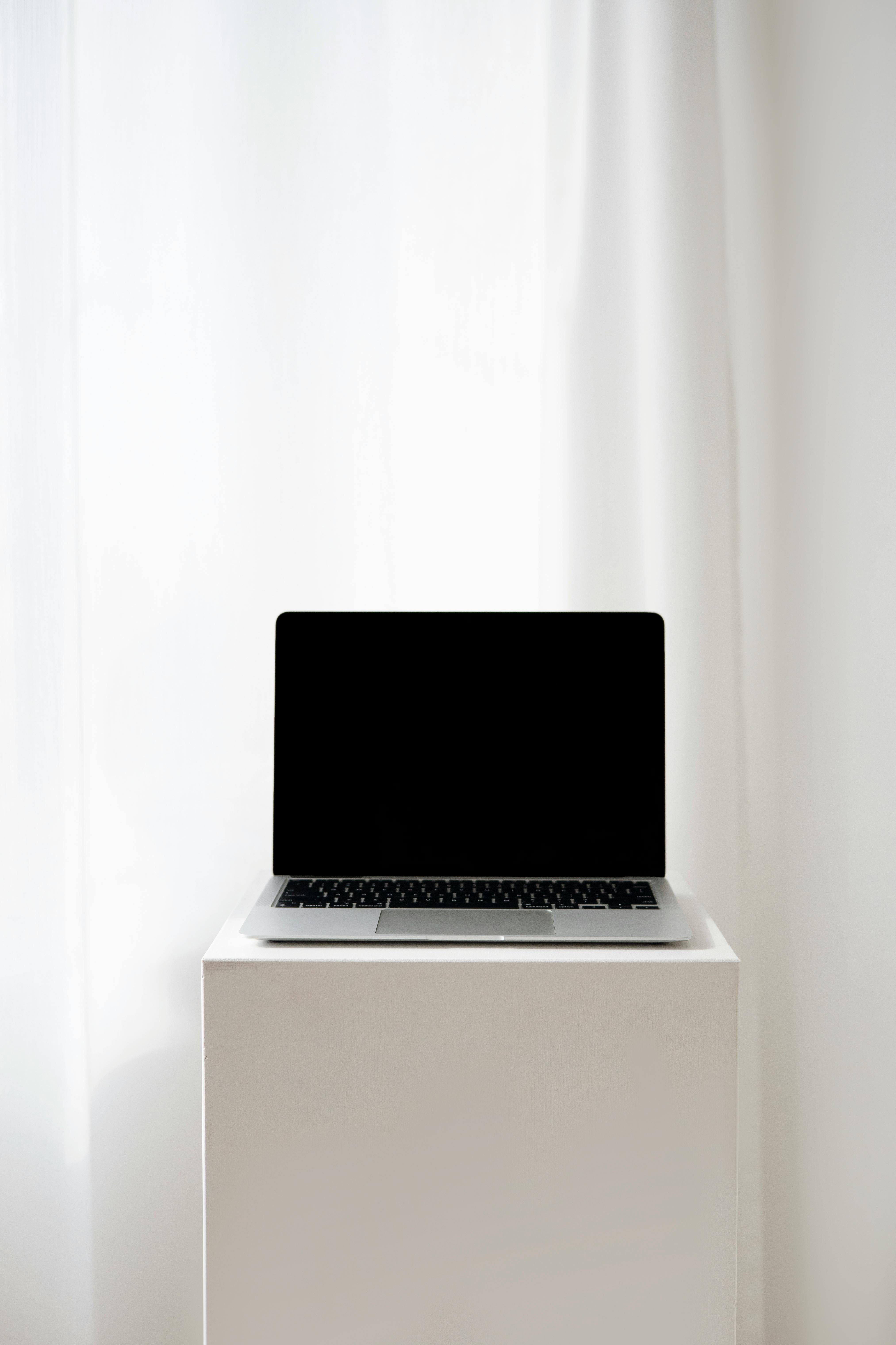 laptop on a white table