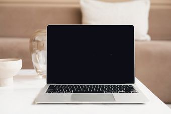 Designer laying out a page on a laptop — photo by Hanna Pad on Pexels