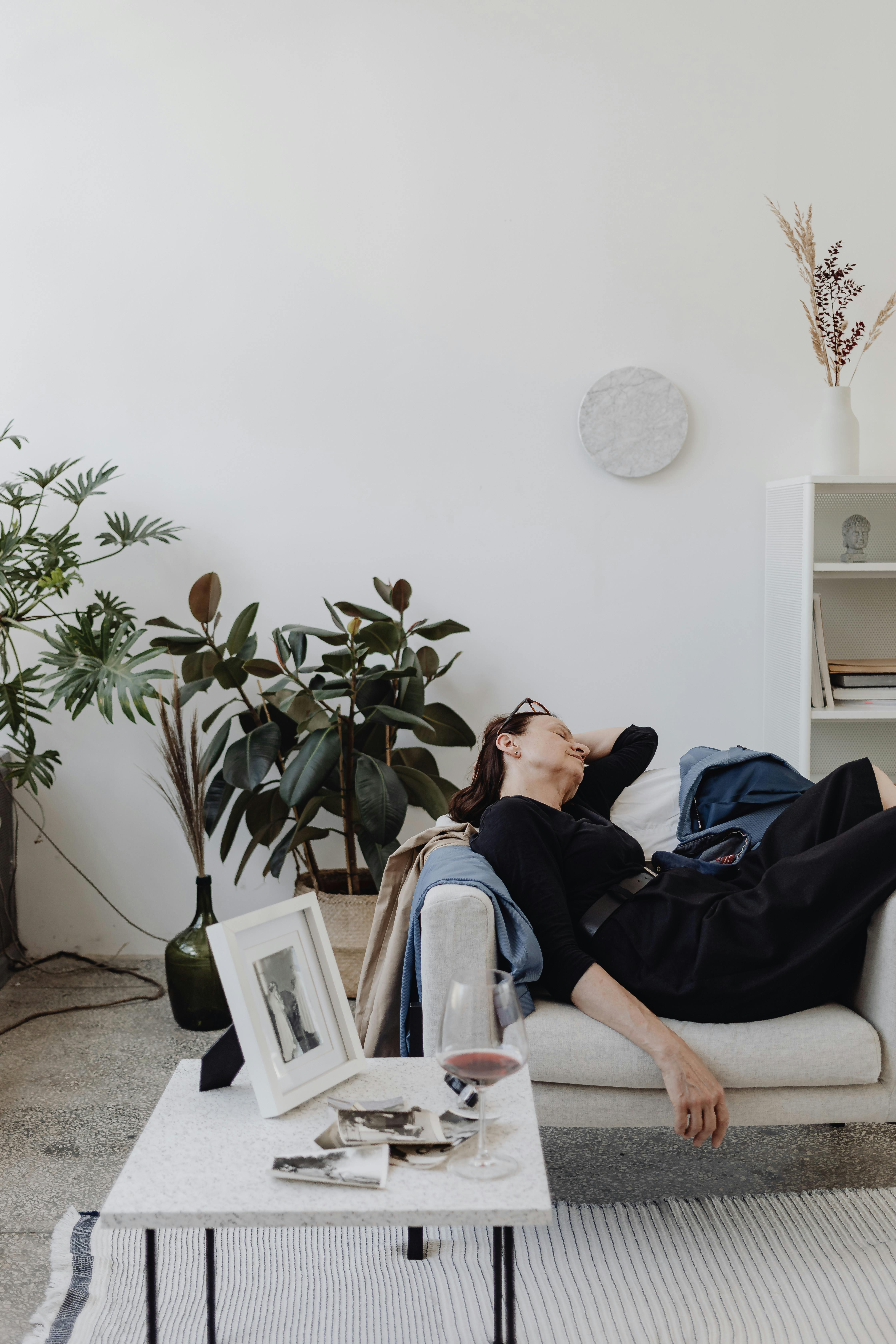 woman sleeping on a sofa after drinking