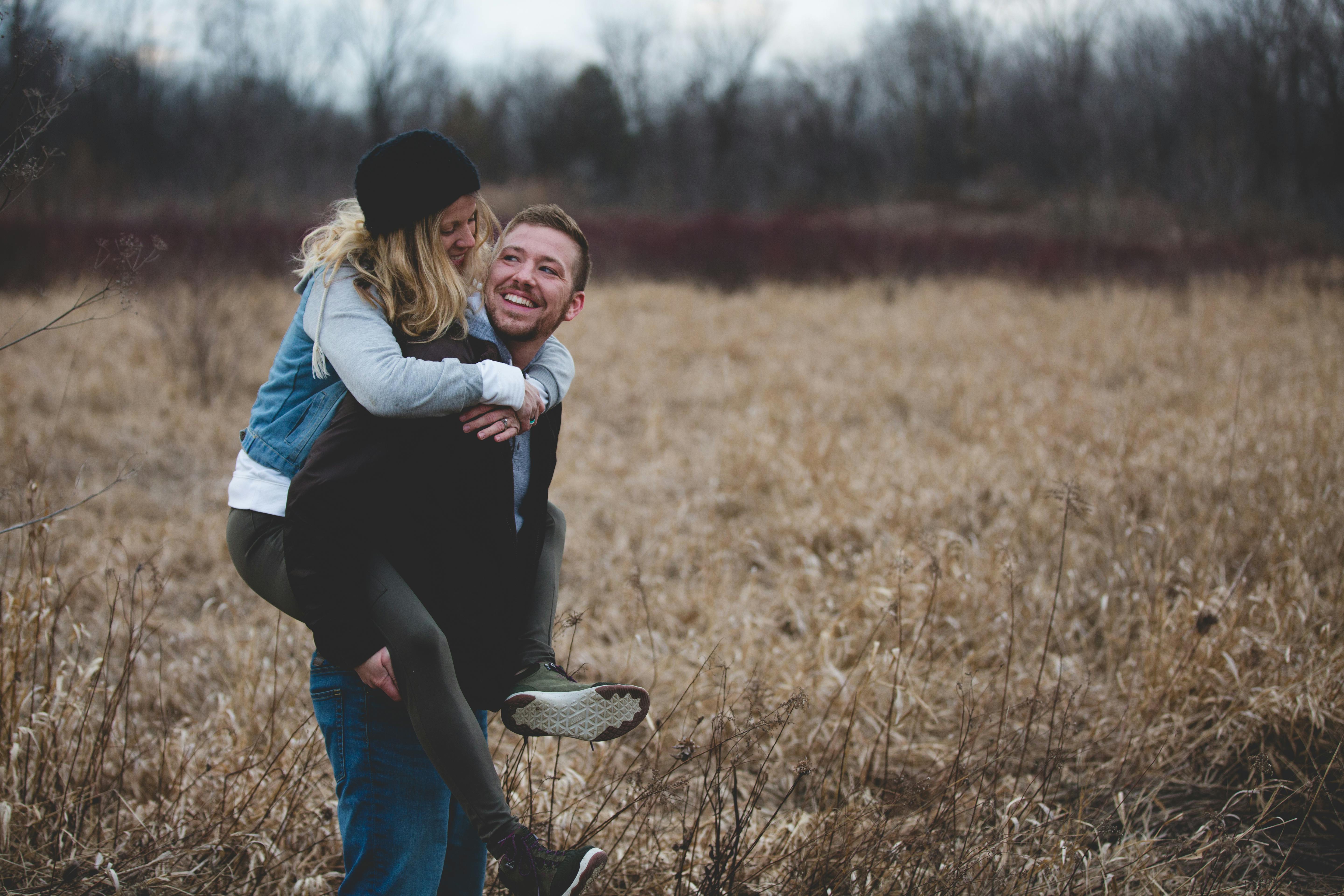 photo of a man carrying his partner