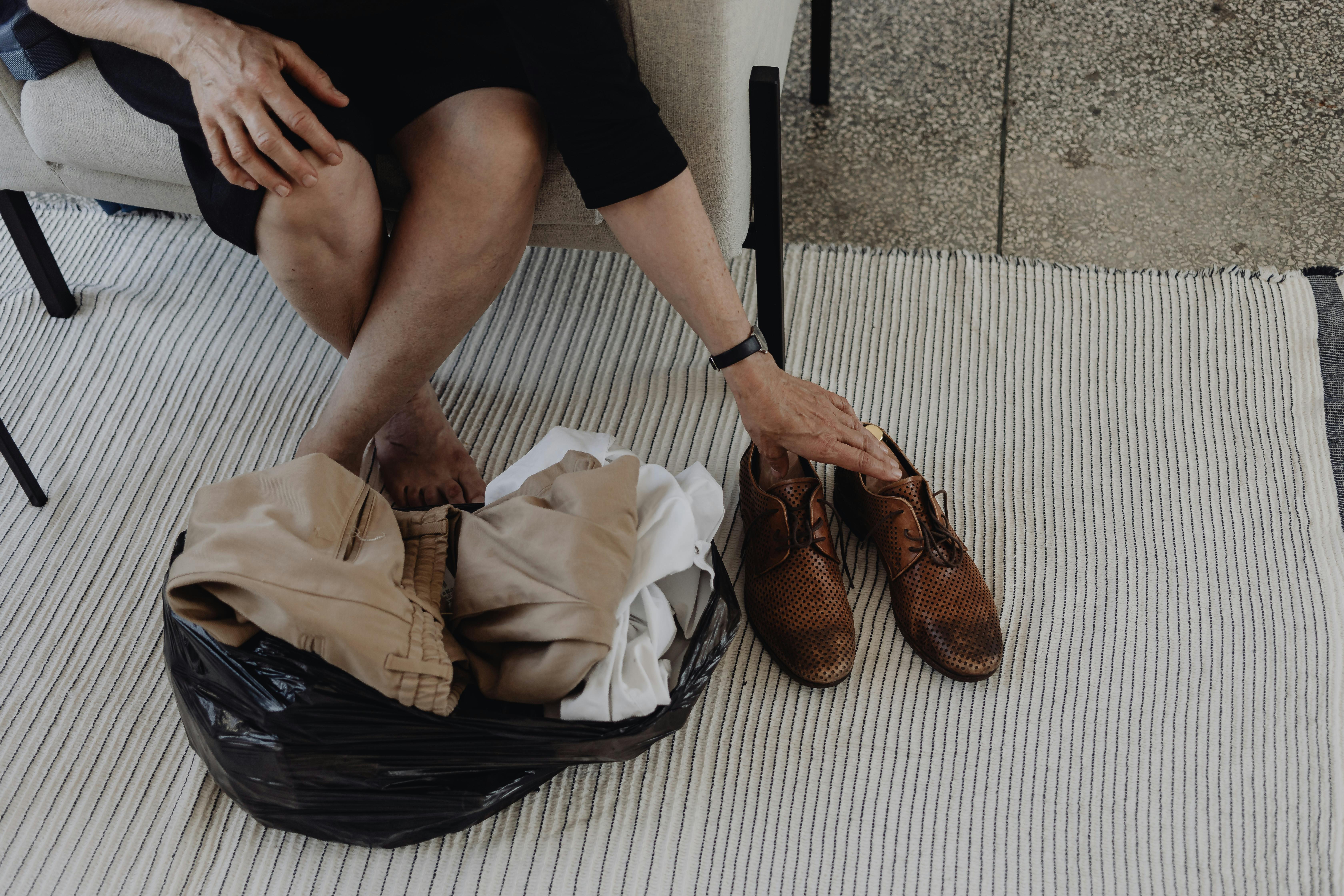 Person walking outside in the morning holding a reusable cup