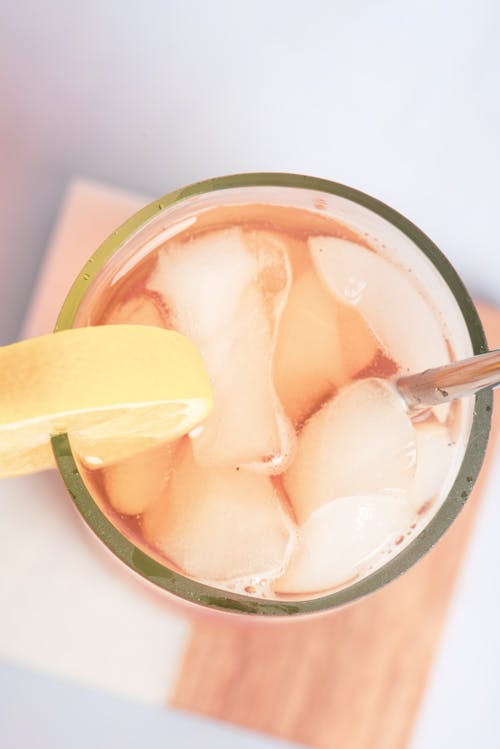 Sliced Lemon in Clear Glass with Ice and Liquid