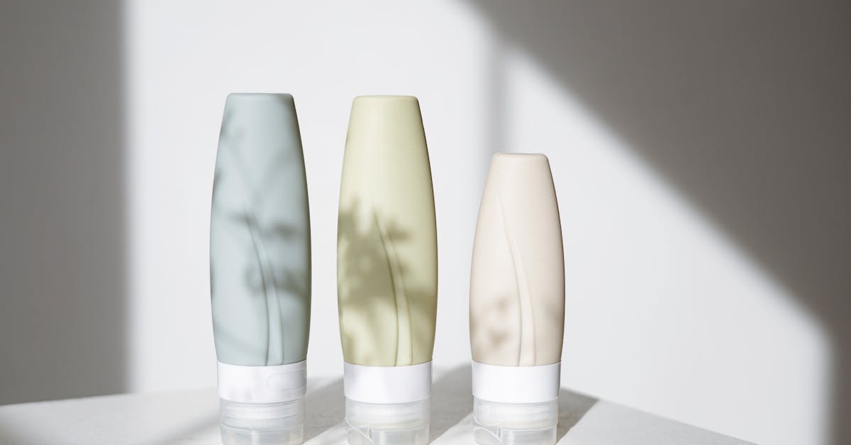 Elegant skincare bottles displayed with shadows creating a minimalist aesthetic. Elegant skincare bottles displayed with shadows creating a minimalist aesthetic.