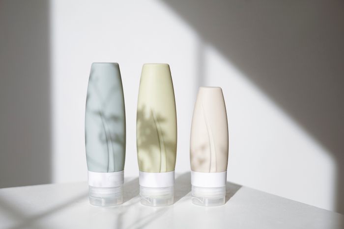 Three soft-coloured bottles in raking light, photo by Hanna Pad on Pexels