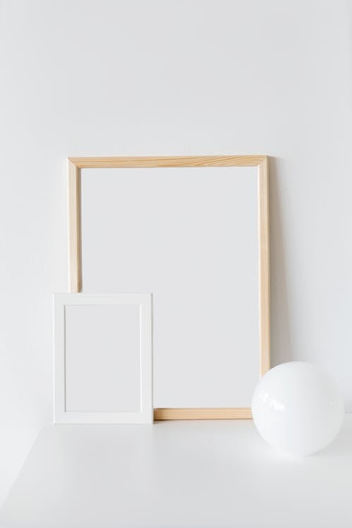 Brown Wooden Frame on White Wall