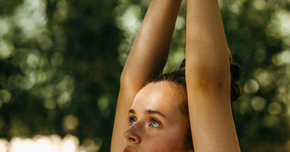 Hand Raises Close Close-Up Shot of a Woman Raising Her Hands · Free Stock Photo