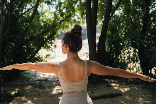 Free A Woman in Activewear Doing Yoga in the Forest Stock Photo