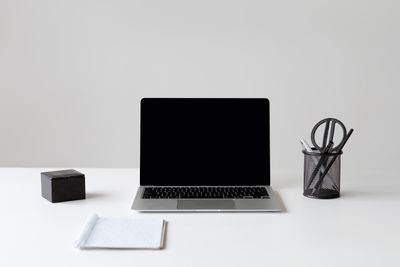 Recording thumbnail — laptop and notepad on a white desk by Hanna Pad on Pexels