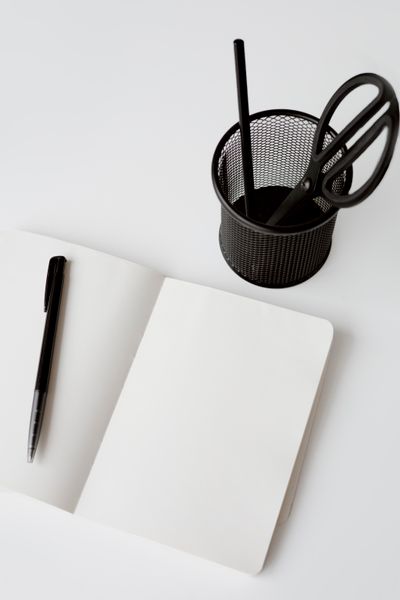 Open notebook, pen and desk tidy — Hanna Pad on Pexels