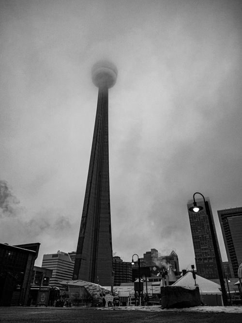 Free Dramatic black and white view of CN Tower enveloped in fog, Toronto, Canada. Stock Photo