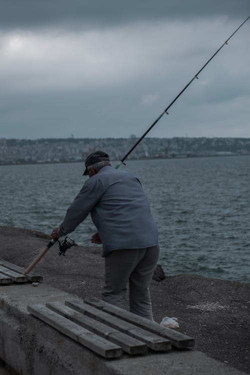 A Man holding a Fishing Rod