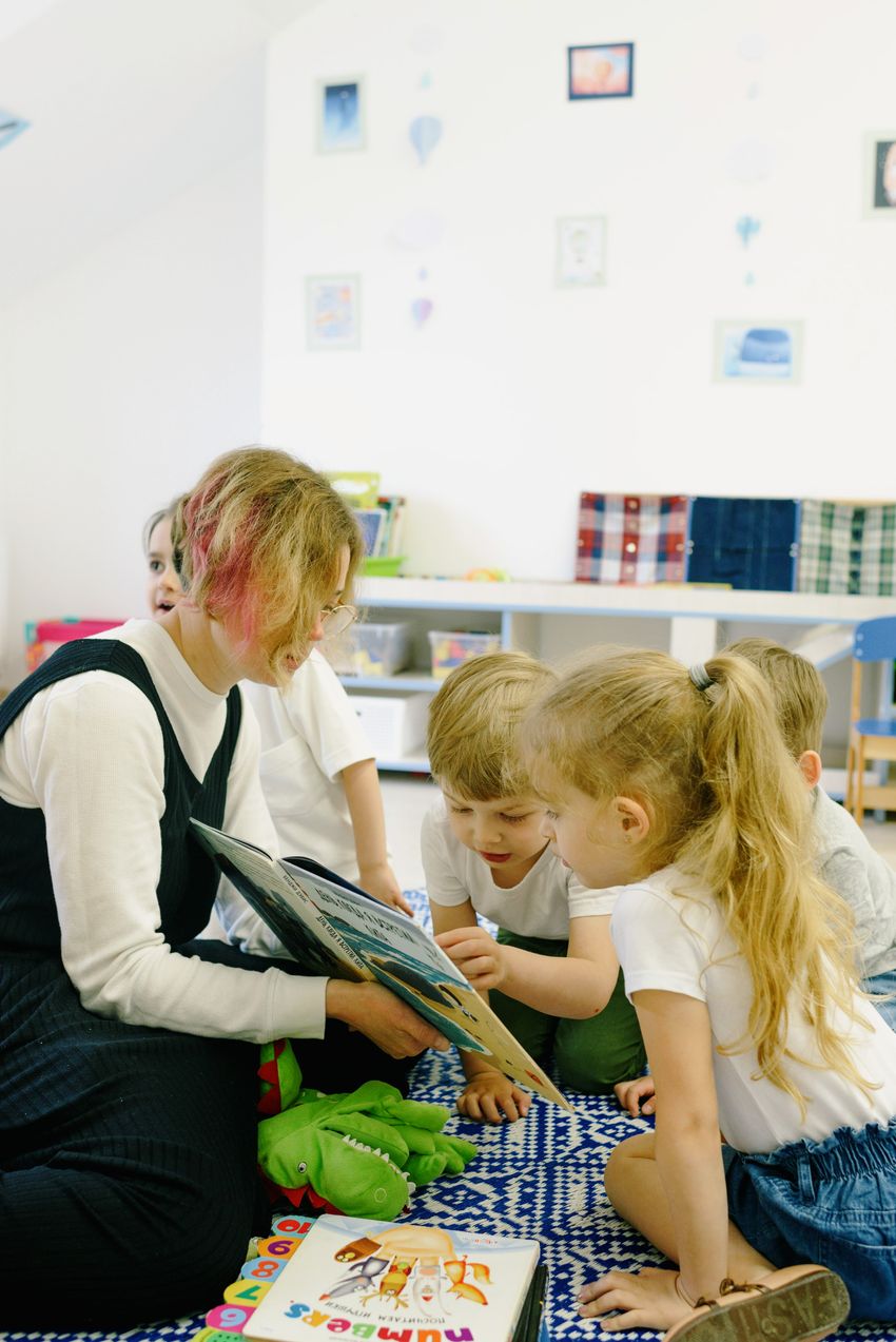 Educator reading with young children