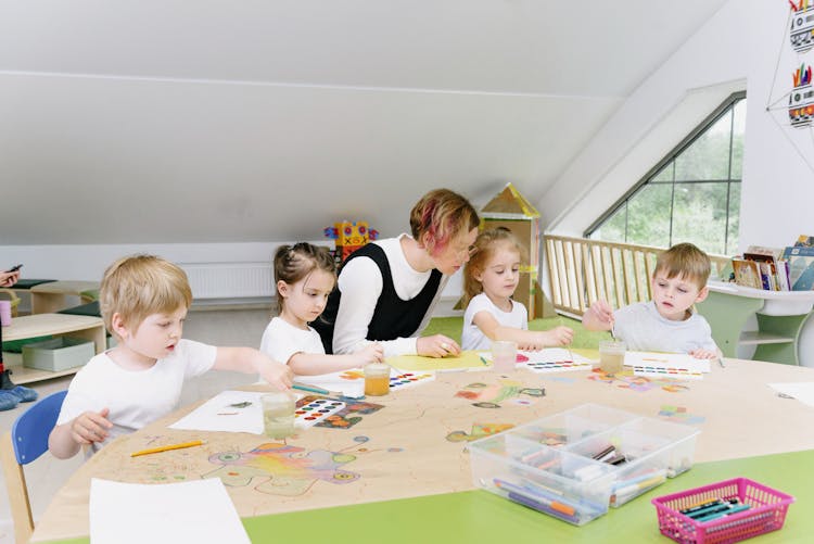 Children Painting In Kindergarten