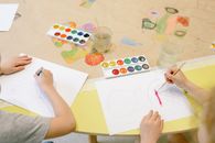 Person Drawing on White Paper