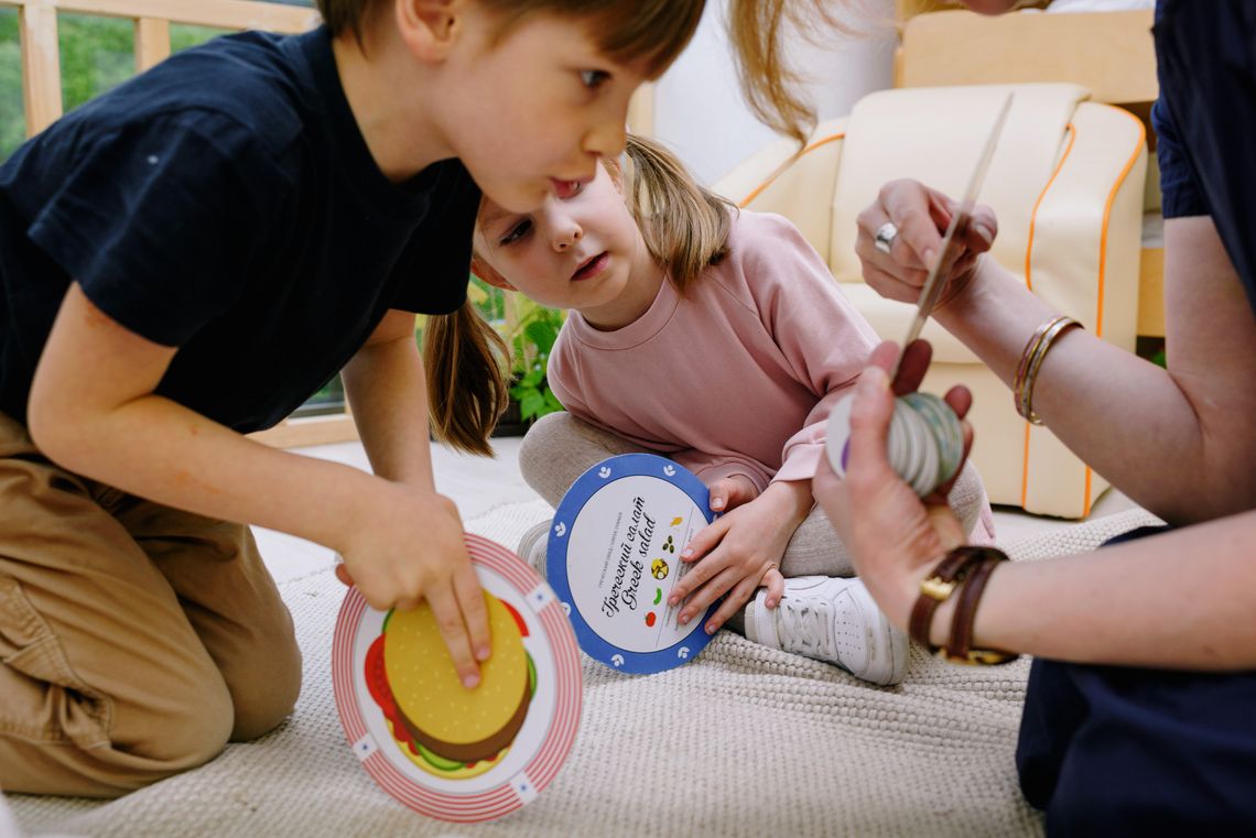 Children learning and playing together with tactile educational toys