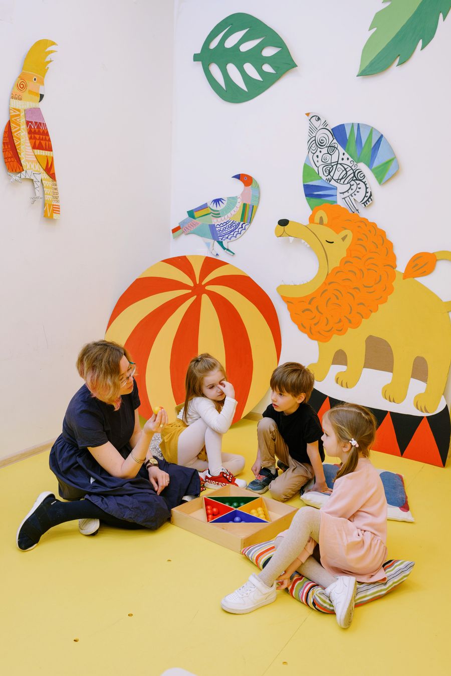 Children playing together in a warm daycare classroom