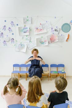 A teacher engaging children in a learning activity in a classroom setting.
