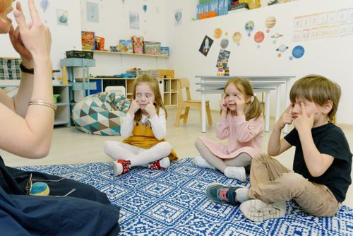 Children playing a fingers game