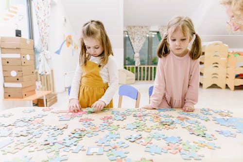 Free Girls Playing With Puzzle Stock Photo