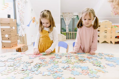 Girls Playing With Puzzle