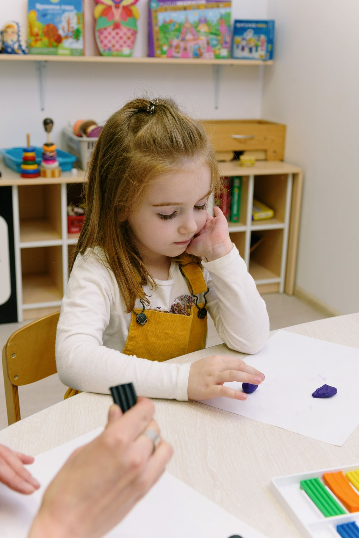 Child happily engaged in a hands-on learning session