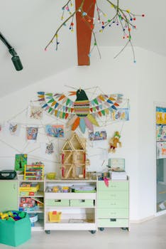 Vibrant kindergarten playroom with colorful bird art and creative craft displays.