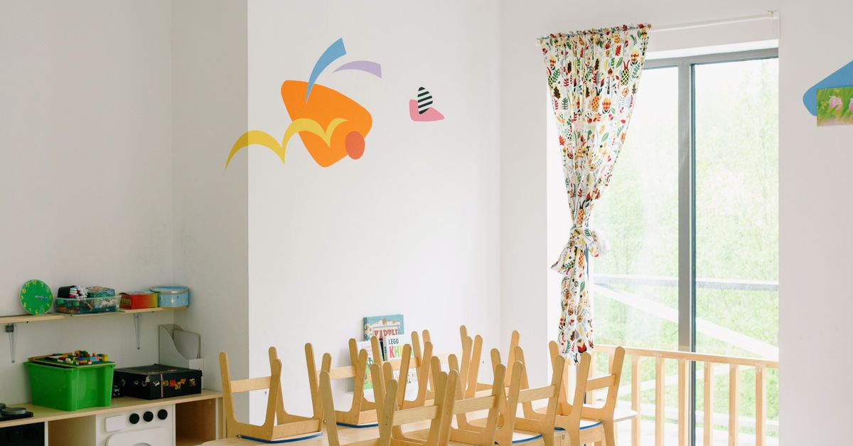 Photo by Ksenia Chernaya Spacious and bright kindergarten classroom with child-sized wooden furniture and playful decor.