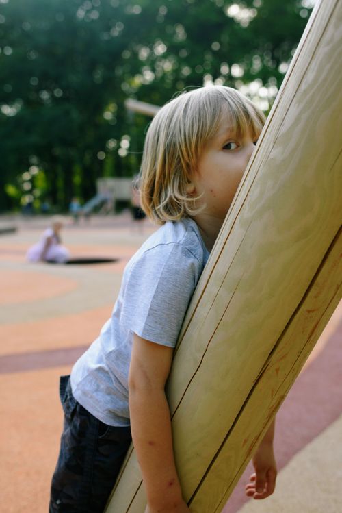 Free A carefree boy plays joyfully on a sunny day at the park. Stock Photo