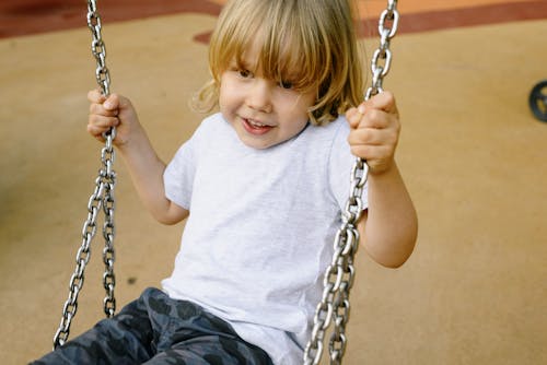 Little Boy Swinging 