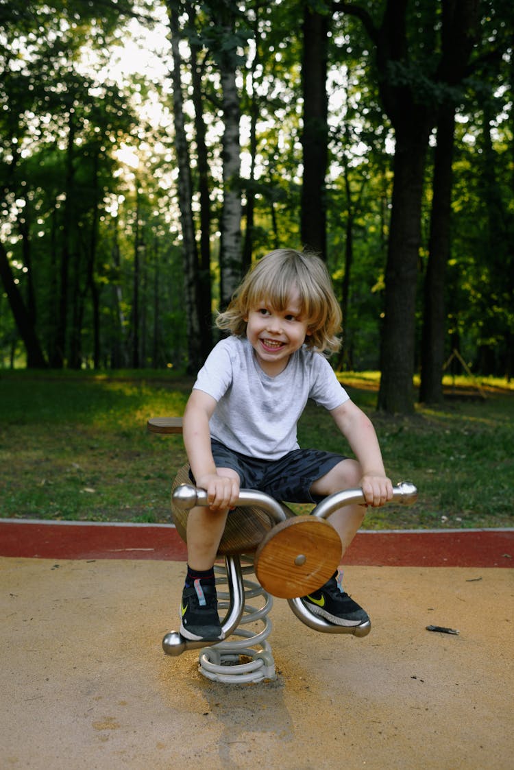 A Boy Playing In The Playground