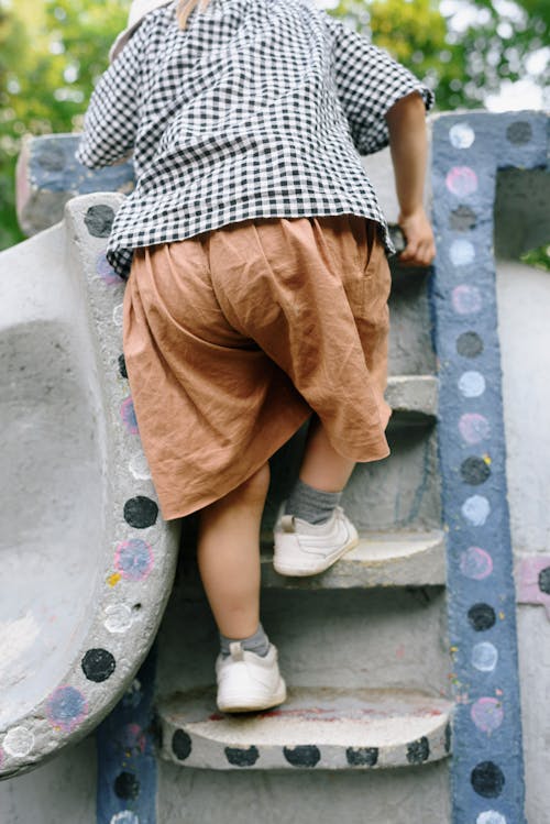 Boy Playing on Playground