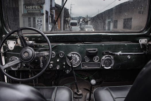 Interior view of a vintage car dashboard with street scene in Cuernavaca, Mexico.
