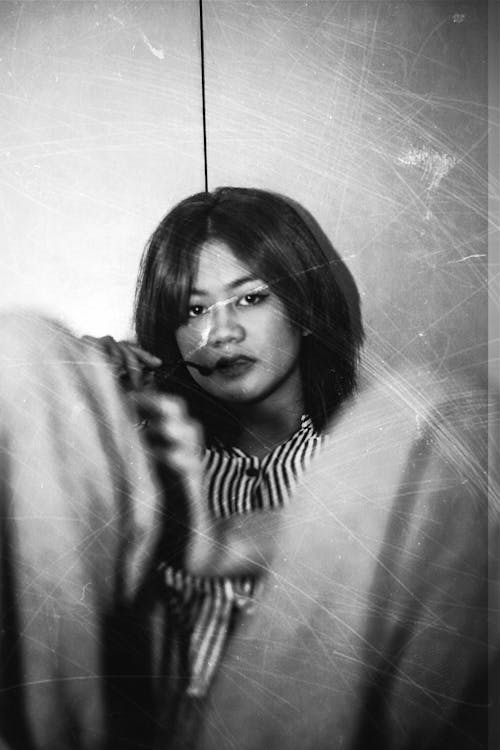 Black and White Photo with Vintage Filter of a Young Asian Woman 