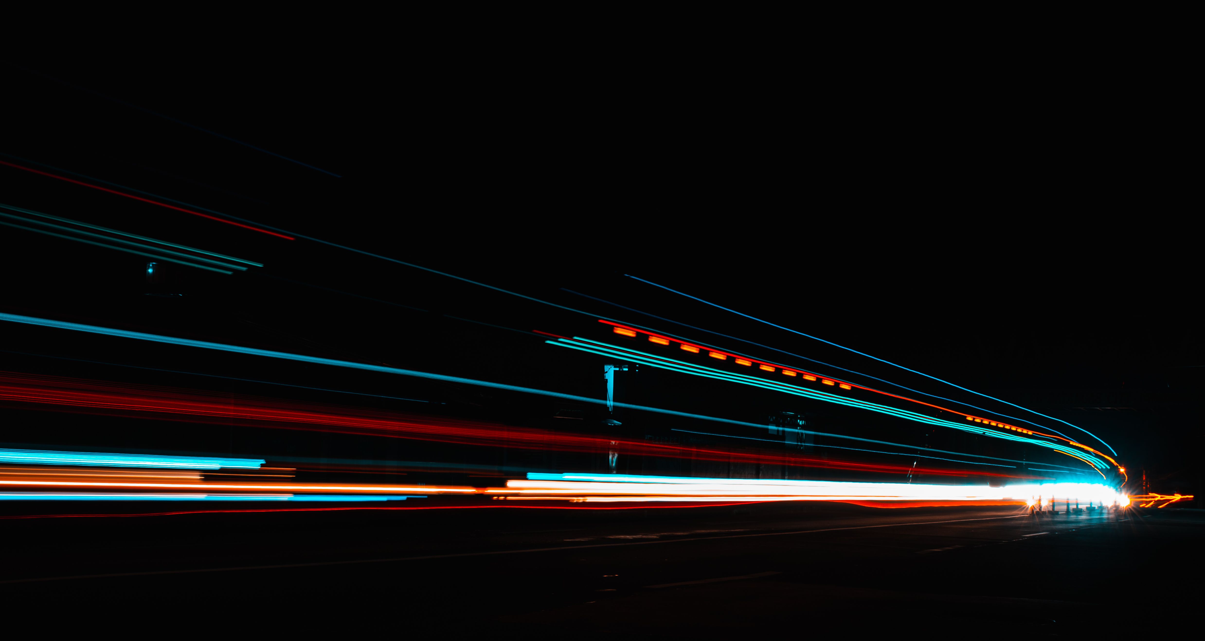 Multi Colored Light Streaks on Black Background · Free Stock Photo